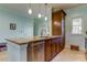 Kitchen with island, granite countertop, and stainless steel dishwasher at 820 Date Palm Ln, St Petersburg, FL 33707