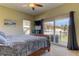 Spacious main bedroom with sliding glass doors leading to a balcony at 820 Date Palm Ln, St Petersburg, FL 33707