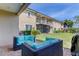 Relaxing patio with outdoor seating and a view of the backyard at 820 Date Palm Ln, St Petersburg, FL 33707