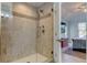 Walk-in shower with glass enclosure and tile surround at 820 Date Palm Ln, St Petersburg, FL 33707