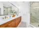 Elegant bathroom with double vanity and marble shower at 8631 5Th Street North, St Petersburg, FL 33702