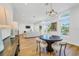 Modern dining area with hardwood floors and stylish chandelier at 8631 5Th Street North, St Petersburg, FL 33702