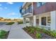 Modern townhouse with spiral staircase and landscaped walkway at 8631 5Th Street North, St Petersburg, FL 33702