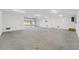 Spacious garage with polished concrete floor and overhead door at 8631 5Th Street North, St Petersburg, FL 33702