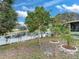 Landscaped backyard with pond view at 9516 Cypress Harbor Dr, Gibsonton, FL 33534