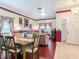 Living and dining area with hardwood floors, sofas, and entryway at 9516 Cypress Harbor Dr, Gibsonton, FL 33534