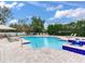 Community pool with lounge chairs at 9516 Cypress Harbor Dr, Gibsonton, FL 33534