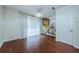 Spacious bedroom with hardwood floors, large window and abstract art at 10425 Westpark Preserve Blvd, Tampa, FL 33625