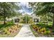 Community clubhouse with landscaped grounds and walkway at 10425 Westpark Preserve Blvd, Tampa, FL 33625