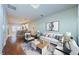 Bright living room with hardwood floors, white couch and modern decor at 10425 Westpark Preserve Blvd, Tampa, FL 33625