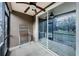 Cozy screened porch with ceiling fan, perfect for relaxing at 10425 Westpark Preserve Blvd, Tampa, FL 33625