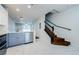 Elegant wooden staircase with black railing at 10425 Westpark Preserve Blvd, Tampa, FL 33625