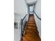 Modern staircase with dark wood and black railing at 10425 Westpark Preserve Blvd, Tampa, FL 33625