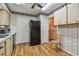 Kitchen area with black refrigerator and wooden cabinets at 11200 102Nd Ave # 138, Seminole, FL 33778