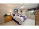 Main bedroom with king-size bed, dresser, and access to balcony at 124 W Cypress Ct, Oldsmar, FL 34677