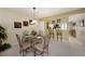 Dining area with a glass-top table and metal chairs at 124 W Cypress Ct, Oldsmar, FL 34677