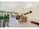 Dining area with a glass-top table and view into living room at 124 W Cypress Ct, Oldsmar, FL 34677