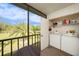 Laundry closet with washer and dryer and screened-in patio view at 124 W Cypress Ct, Oldsmar, FL 34677