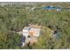 Aerial view of house and surrounding area, showcasing the property's serene lakeside setting at 13833 Vacation Ln, Odessa, FL 33556