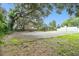 Outdoor basketball court with surrounding trees at 13833 Vacation Ln, Odessa, FL 33556