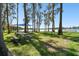 Scenic lakeside picnic area with shaded tables and a tranquil view at 13833 Vacation Ln, Odessa, FL 33556