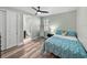 Cozy bedroom featuring a full bed and an en-suite bathroom at 1525 Banner Elk St, Valrico, FL 33594