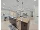 Bright and airy kitchen island features granite countertops and stainless steel dishwasher at 1525 Banner Elk St, Valrico, FL 33594