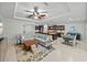 Spacious living area flowing into the kitchen and dining area, with stylish decor and tile flooring at 1525 Banner Elk St, Valrico, FL 33594