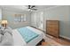 Main bedroom features wood floors, natural lighting and a ceiling fan at 1525 Banner Elk St, Valrico, FL 33594