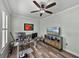 Home office features wood floors, modern desk setup and media center at 1525 Banner Elk St, Valrico, FL 33594