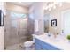 Modern bathroom with a glass shower and blue vanity at 1818 4Th E St, Palmetto, FL 34221