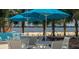 Relaxing beachside seating area with umbrellas and tables at 1818 4Th E St, Palmetto, FL 34221