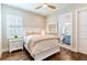 Bright bedroom with white furniture and en-suite bathroom at 1818 4Th E St, Palmetto, FL 34221