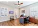 Home office with built-in shelving and hardwood floors at 1818 4Th E St, Palmetto, FL 34221