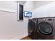 Laundry room with LG washer and dryer, security camera, and ample storage at 1818 4Th E St, Palmetto, FL 34221