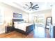 Main bedroom with hardwood floors and sliding doors to the patio at 1818 4Th E St, Palmetto, FL 34221