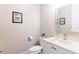 Modern powder room with white vanity and a white toilet at 1818 4Th E St, Palmetto, FL 34221