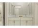 Modern double vanity bathroom with marble countertop and spacious shower at 18426 Serene Lake Loop, Lutz, FL 33548