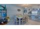 Coastal-themed dining area with a six-chair table at 19029 Us Highway 19 N # 32B, Clearwater, FL 33764