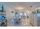 Bright dining room with white table and chairs, and light blue walls at 19029 Us Highway 19 N # 32B, Clearwater, FL 33764