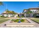 Community clubhouse with landscaping and fountain at 19029 Us Highway 19 N # 32B, Clearwater, FL 33764