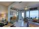 Living room with water views and comfortable seating at 19029 Us Highway 19 N # 32B, Clearwater, FL 33764