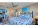 Main bedroom with coastal bedding and a ceiling fan at 19029 Us Highway 19 N # 32B, Clearwater, FL 33764