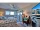 Main bedroom with coastal bedding and water views at 19029 Us Highway 19 N # 32B, Clearwater, FL 33764