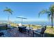 Waterfront patio furniture with umbrella and fire pit at 19029 Us Highway 19 N # 32B, Clearwater, FL 33764