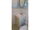 Bathroom with vanity, toilet and an oval mirror at 2020 N World Parkway Blvd # 12, Clearwater, FL 33755