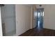 Bedroom with double closets and dark wood flooring at 2020 N World Parkway Blvd # 12, Clearwater, FL 33755