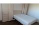 Bedroom with a wall-mounted bed and built-in storage at 2020 N World Parkway Blvd # 12, Clearwater, FL 33755