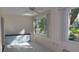 Bright Florida room with tile floors, built-in cabinet, and large windows at 2020 N World Parkway Blvd # 12, Clearwater, FL 33755