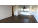 Spacious living room with dark laminate flooring at 2020 N World Parkway Blvd # 12, Clearwater, FL 33755